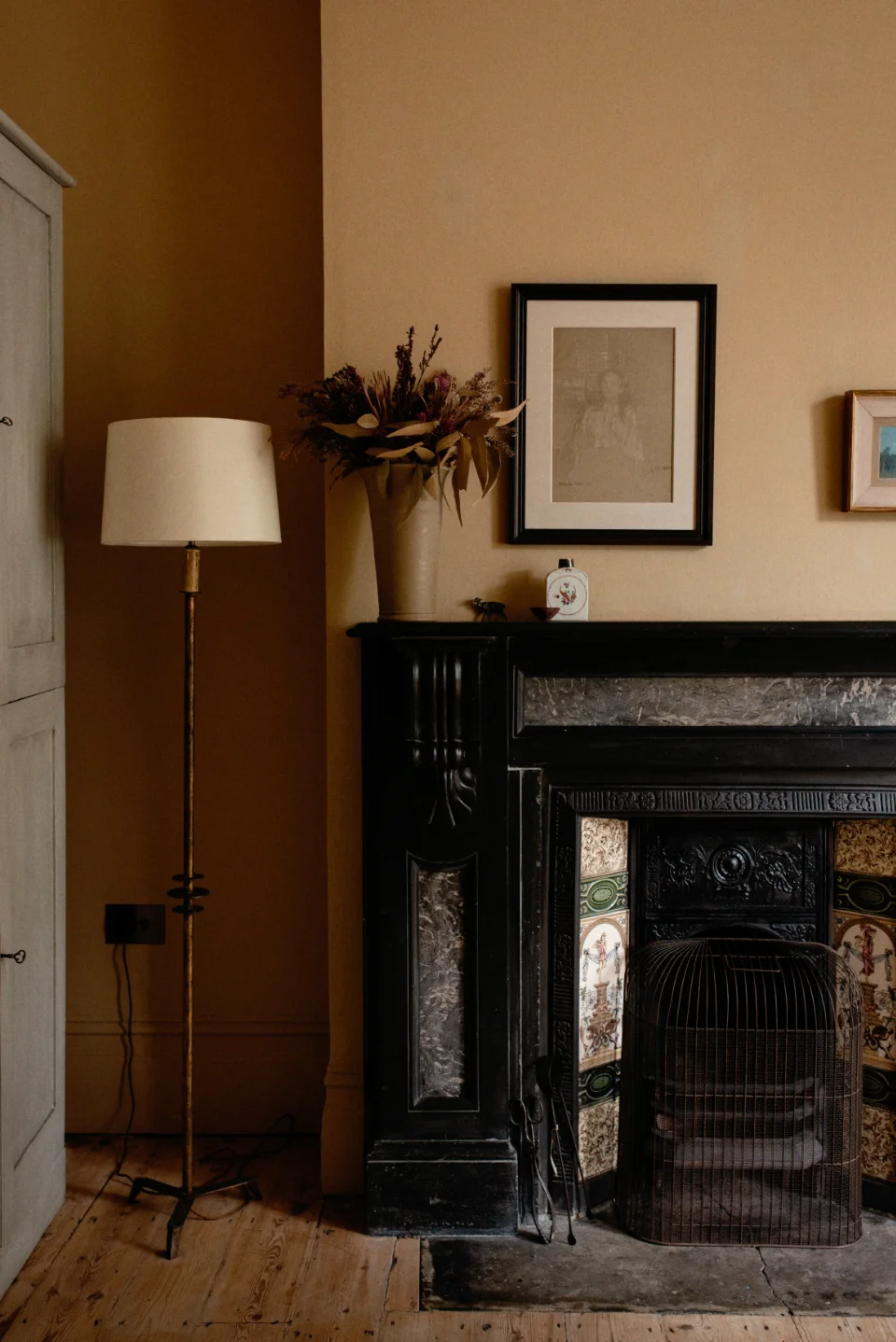 Living room with a mix of antique furniture and contemporary carpentry in Hackney home