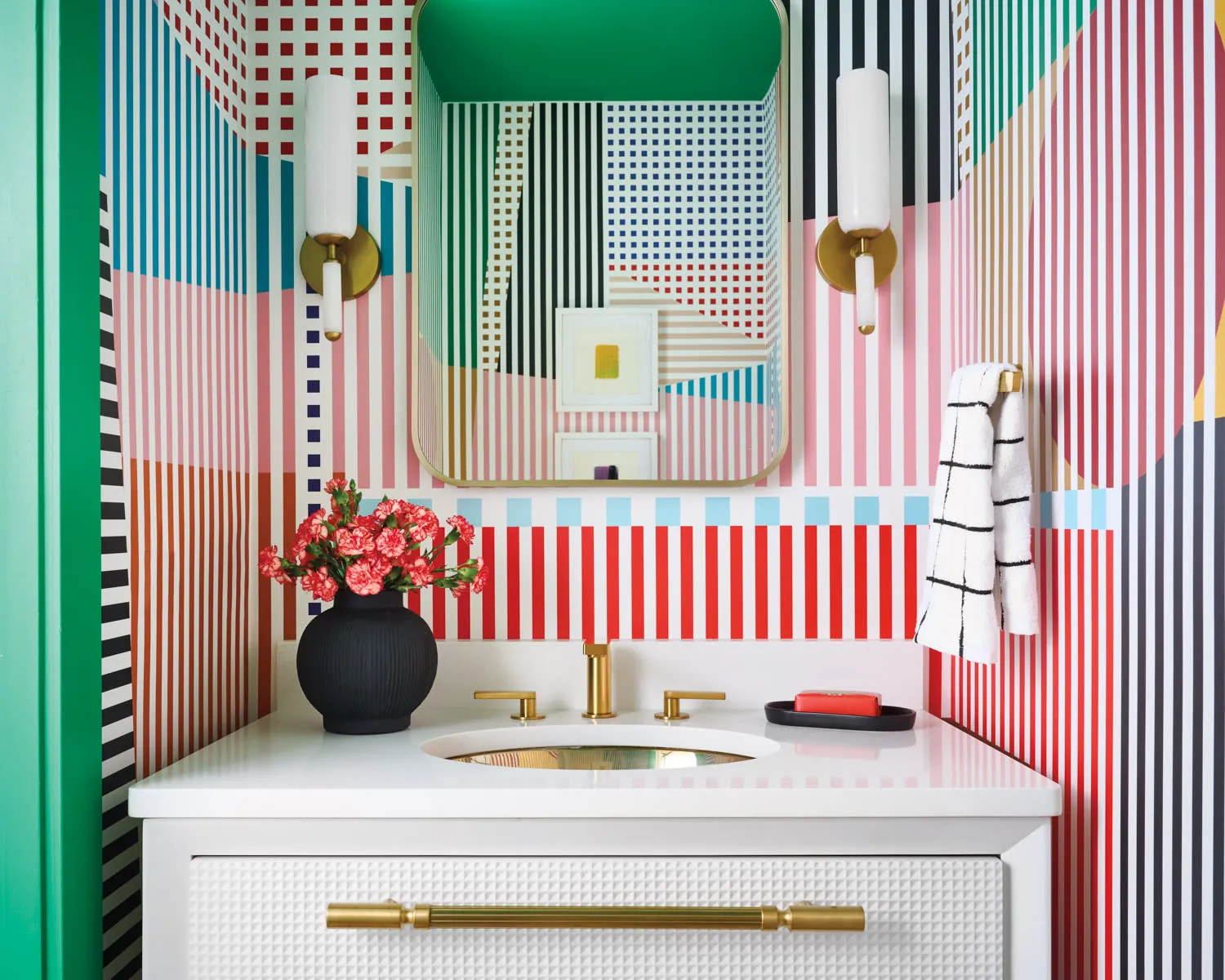 Lined in bright coral and viridian hues, a podwer room